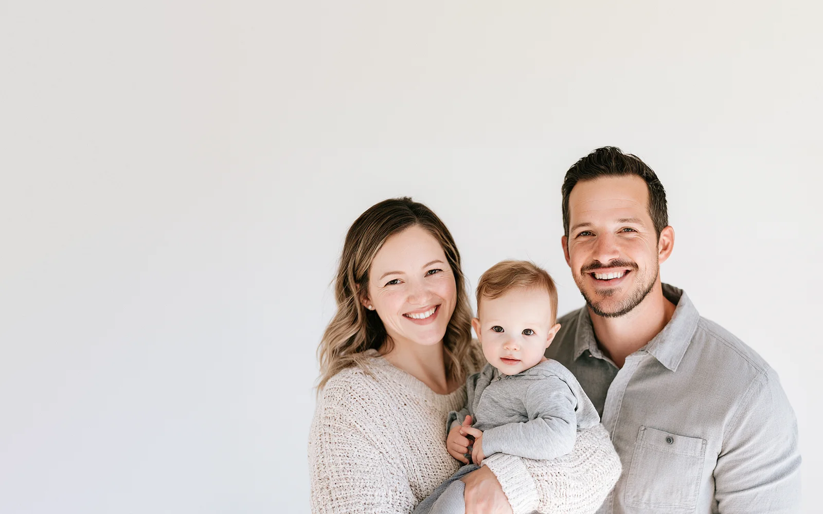 A young family smiling together
